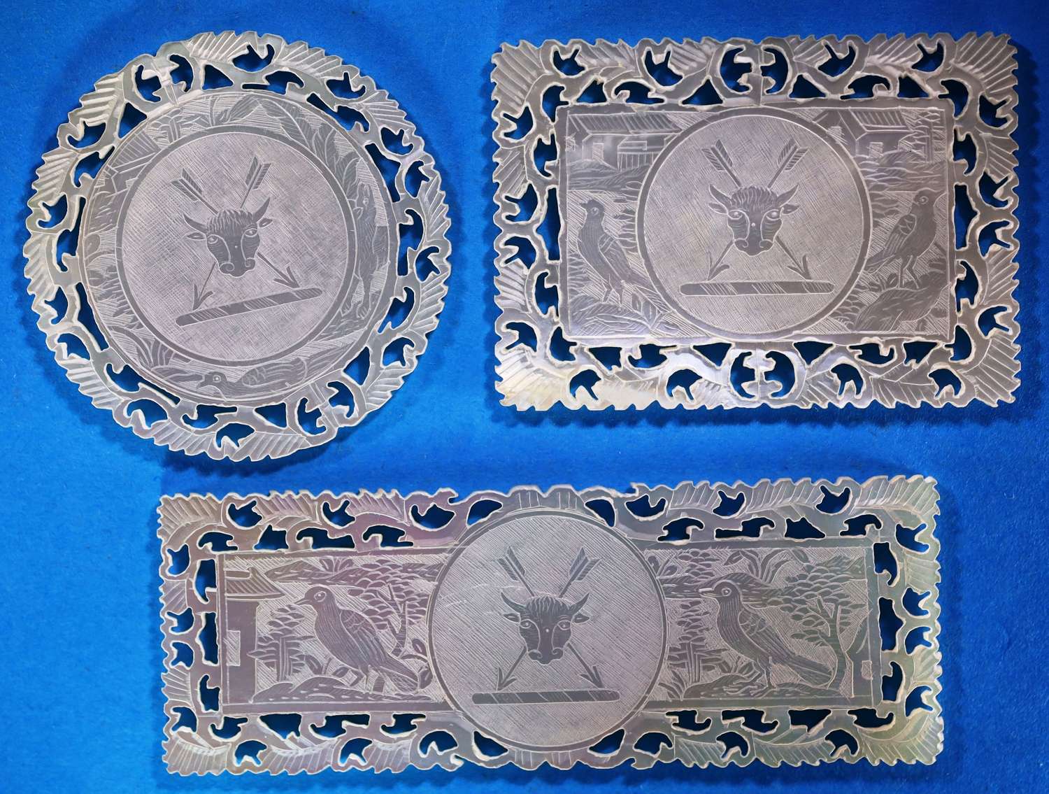 Set of three finely fretted counters for unidentified family