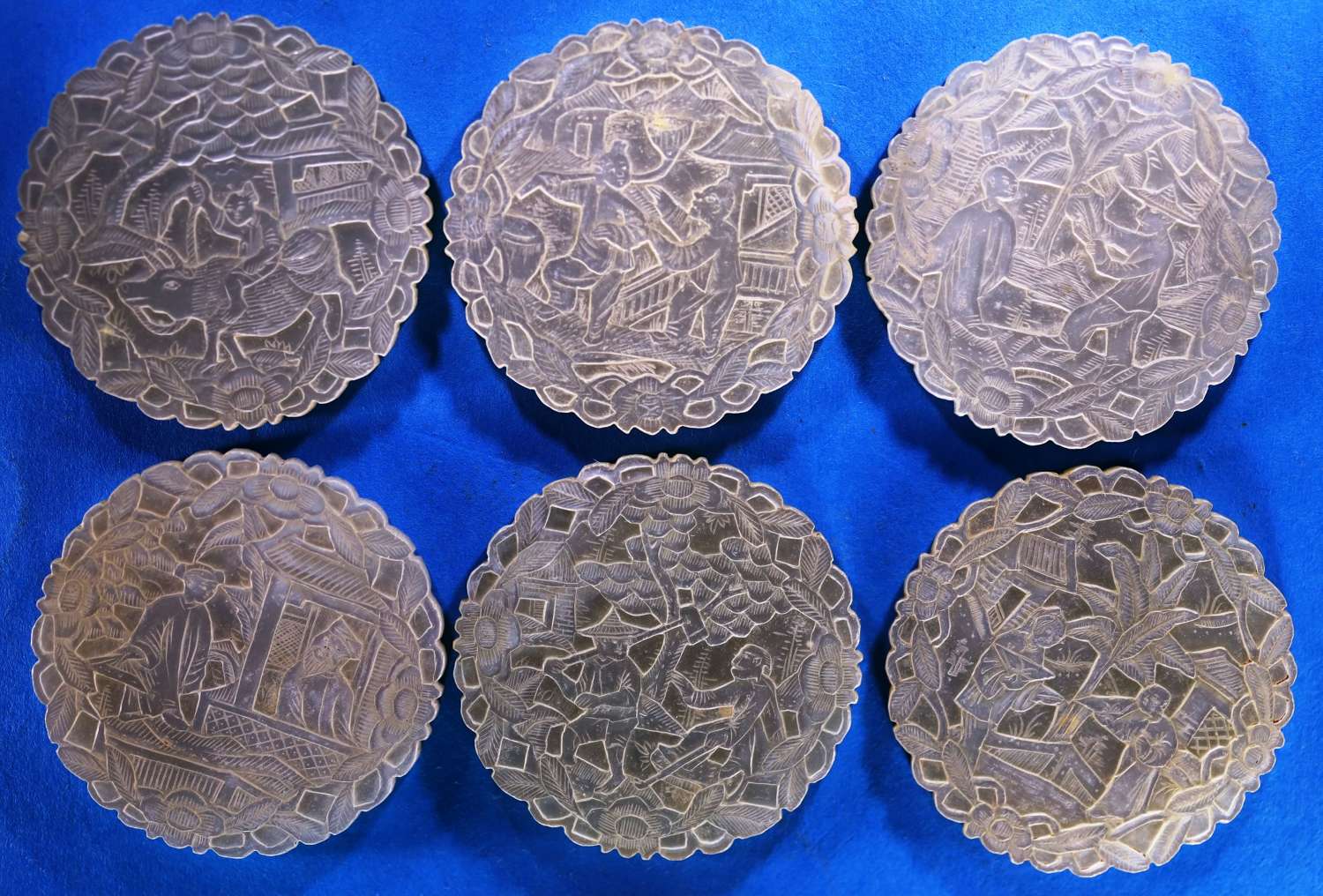 Six top quality deep-carved rounds