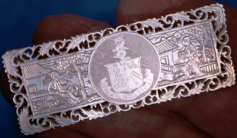 Deep-carved fretted armorial!