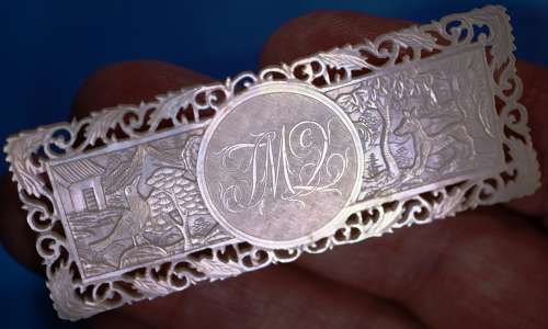Deep-carved fretted armorial!