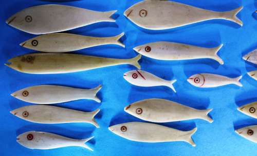 Group of 36 bone fish-shaped gaming counters
