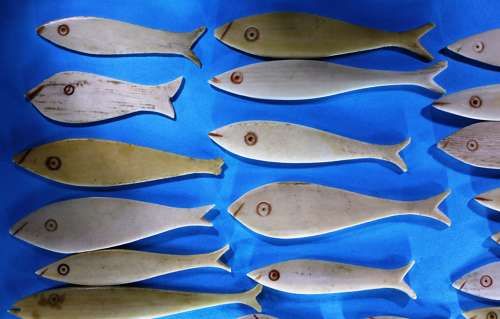Group of 36 bone fish-shaped gaming counters