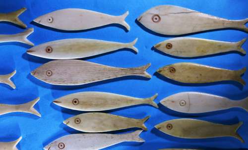 Group of 36 bone fish-shaped gaming counters