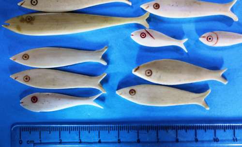 Group of 36 bone fish-shaped gaming counters