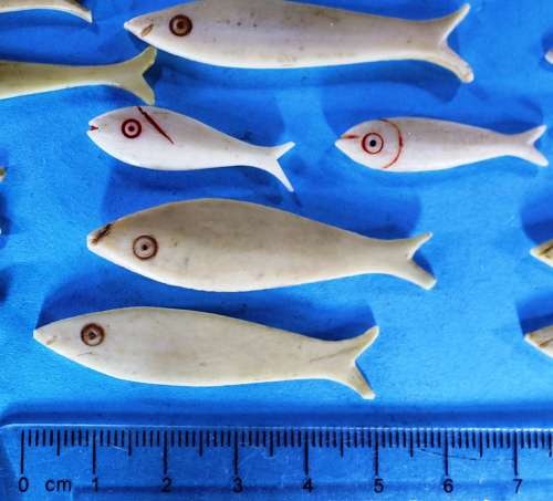 Group of 36 bone fish-shaped gaming counters
