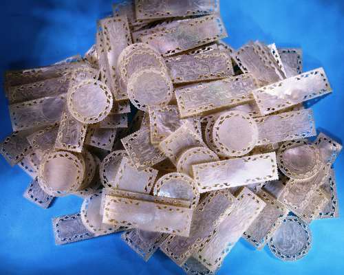 Group of 120 small fretted counters